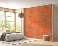 Modern bedroom featuring a red brick wallpaper and a large window.