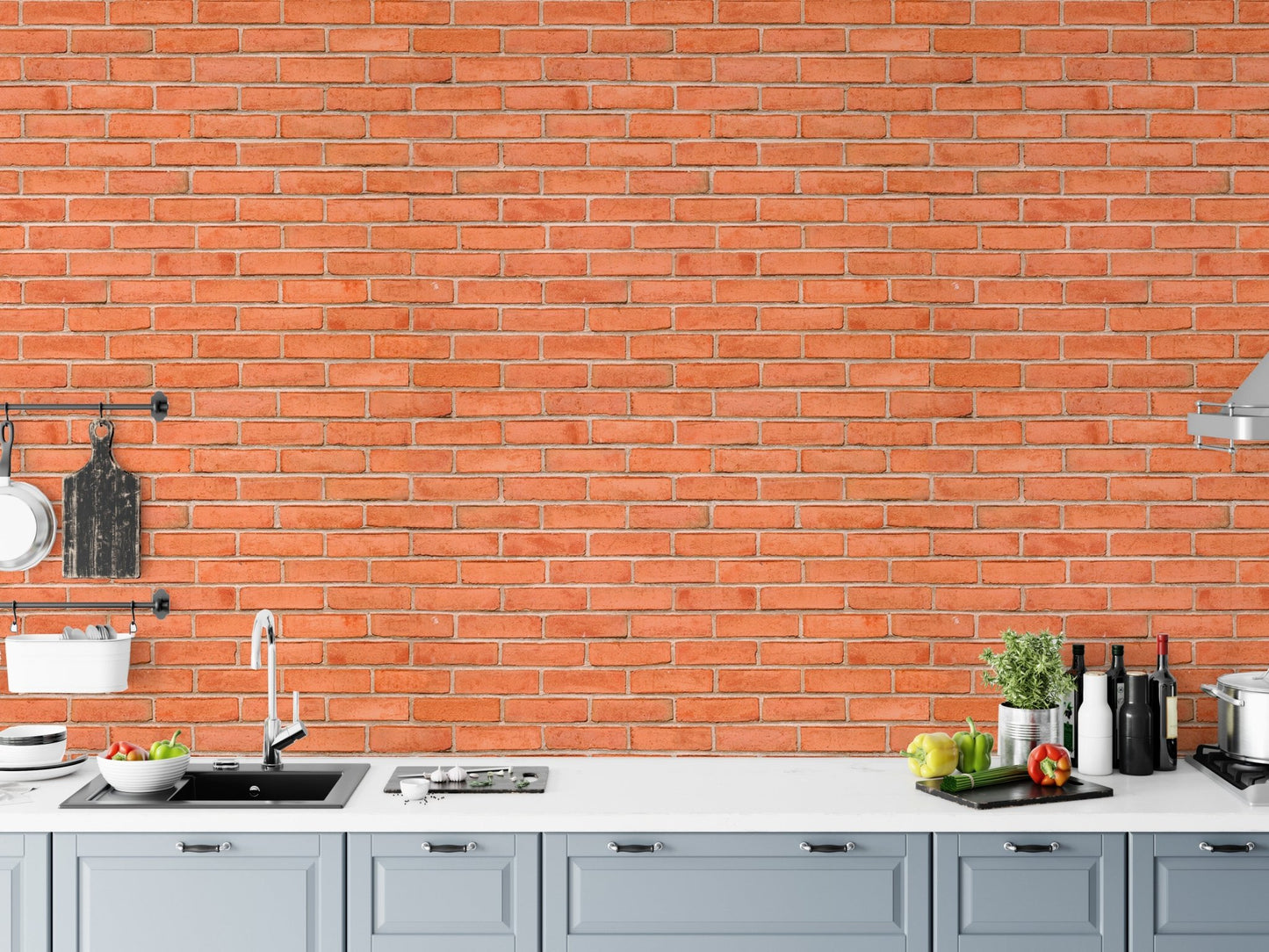 Red brick wallpaper used as a kitchen backsplash behind a white counter.