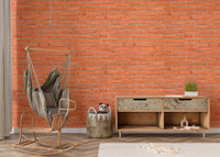 Red brick wallpaper in a living area with a rocking chair and wooden sideboard.