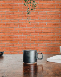 Matte finish red brick wallpaper for a feature wall in a residential space.