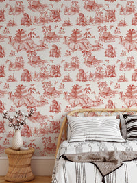 Bedroom feature wall using red chinoiserie wallpaper with a brown throw blanket.