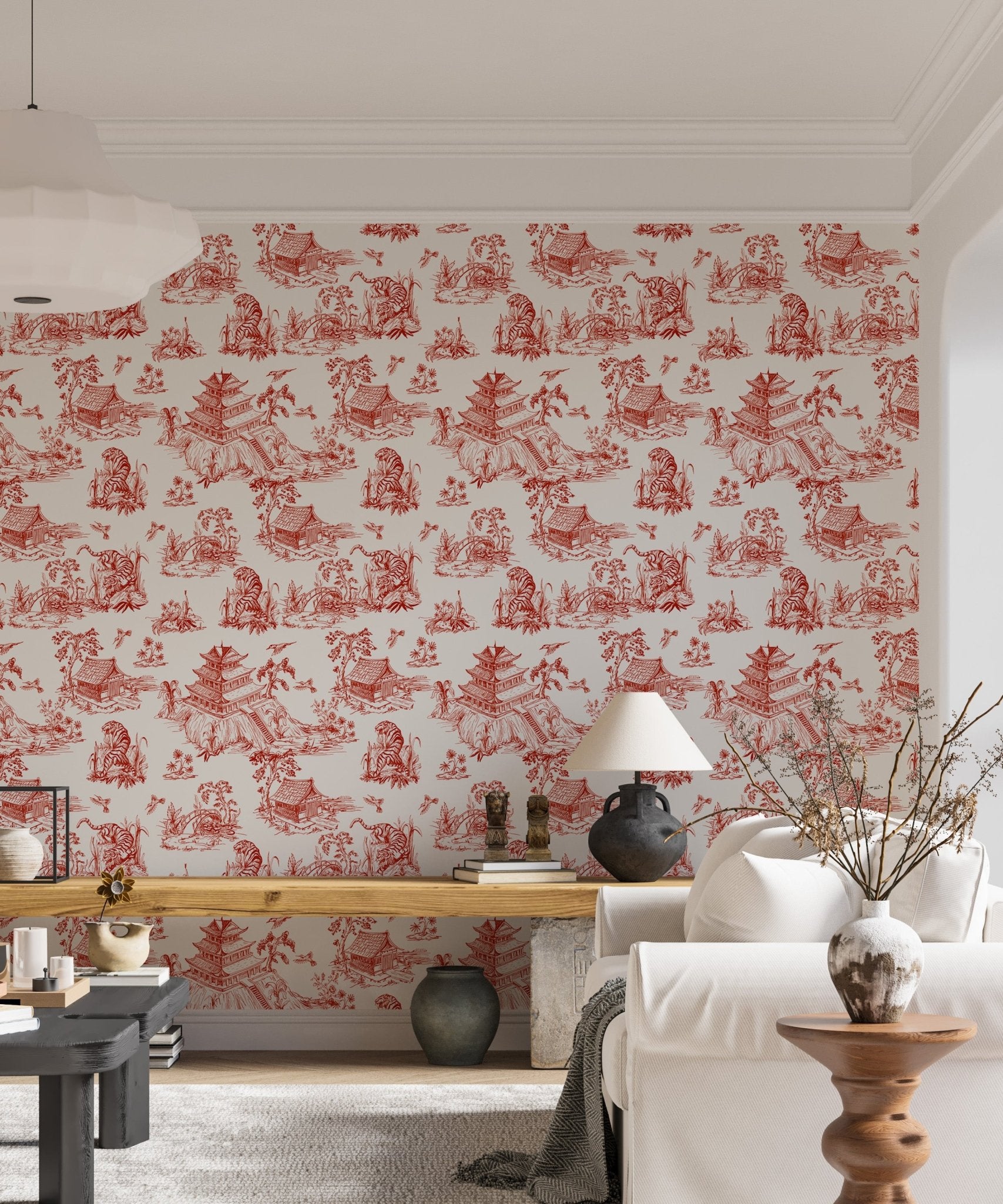 Red color seamless pattern chinoiserie style wallpaper behind a white bedside table.