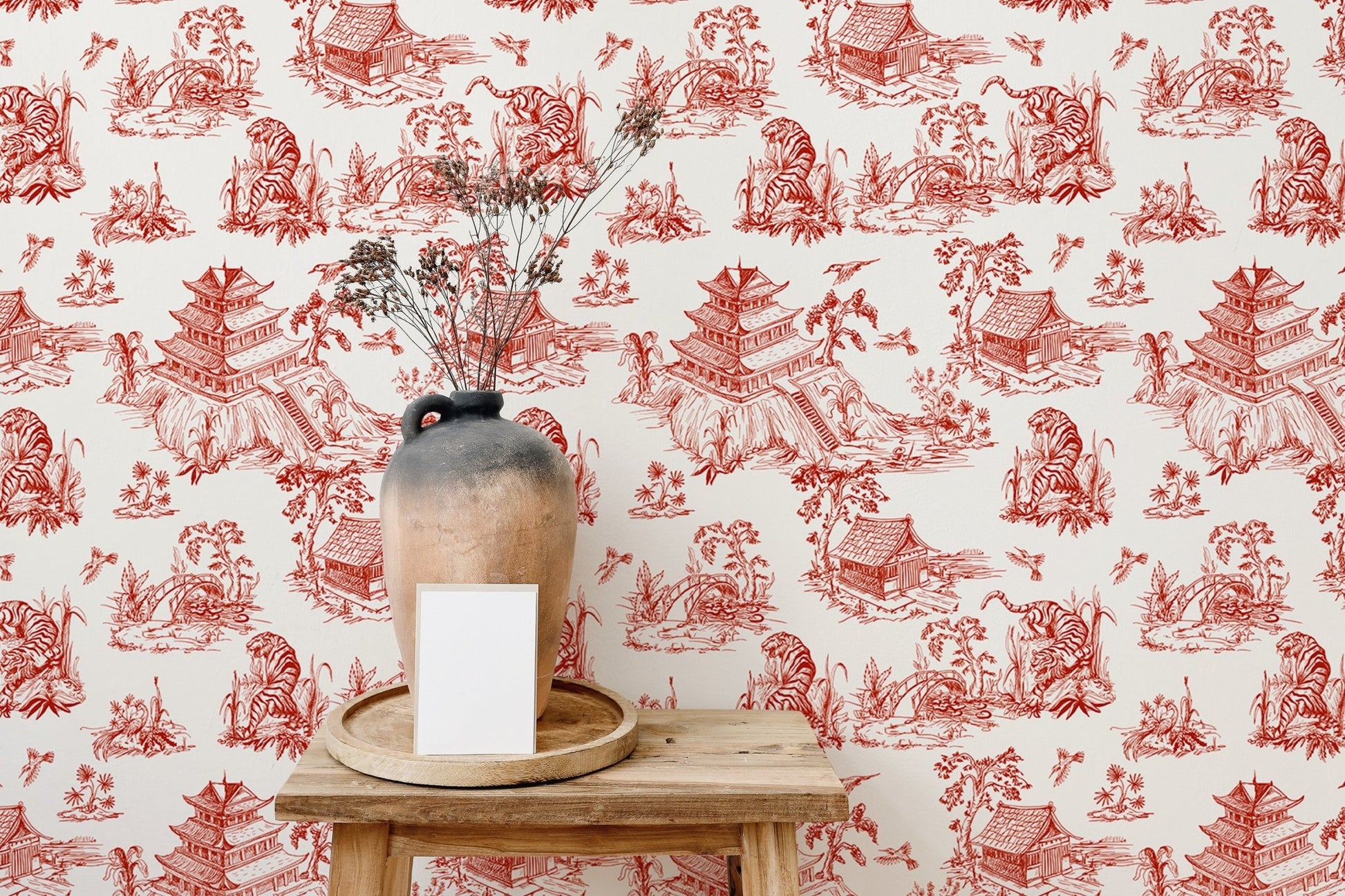 Wallpaper with red scenic illustrations in a room with natural light.