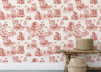 Red patterned wallpaper behind a rustic wooden bench and floral vase.