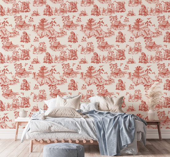 Red color seamless pattern chinoiserie style wallpaper in a bedroom with white bedding.