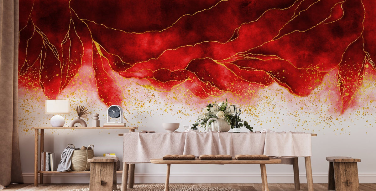 Wooden dining table set against a red floral style wall mural.