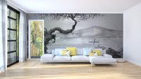 Minimalist living room featuring a grey lakeview wall mural behind a white sectional sofa.