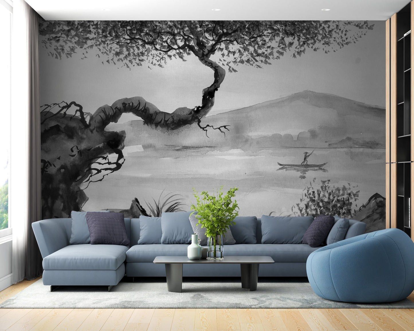 Blue sectional sofa placed against a grey lakeview wall mural in a contemporary room.