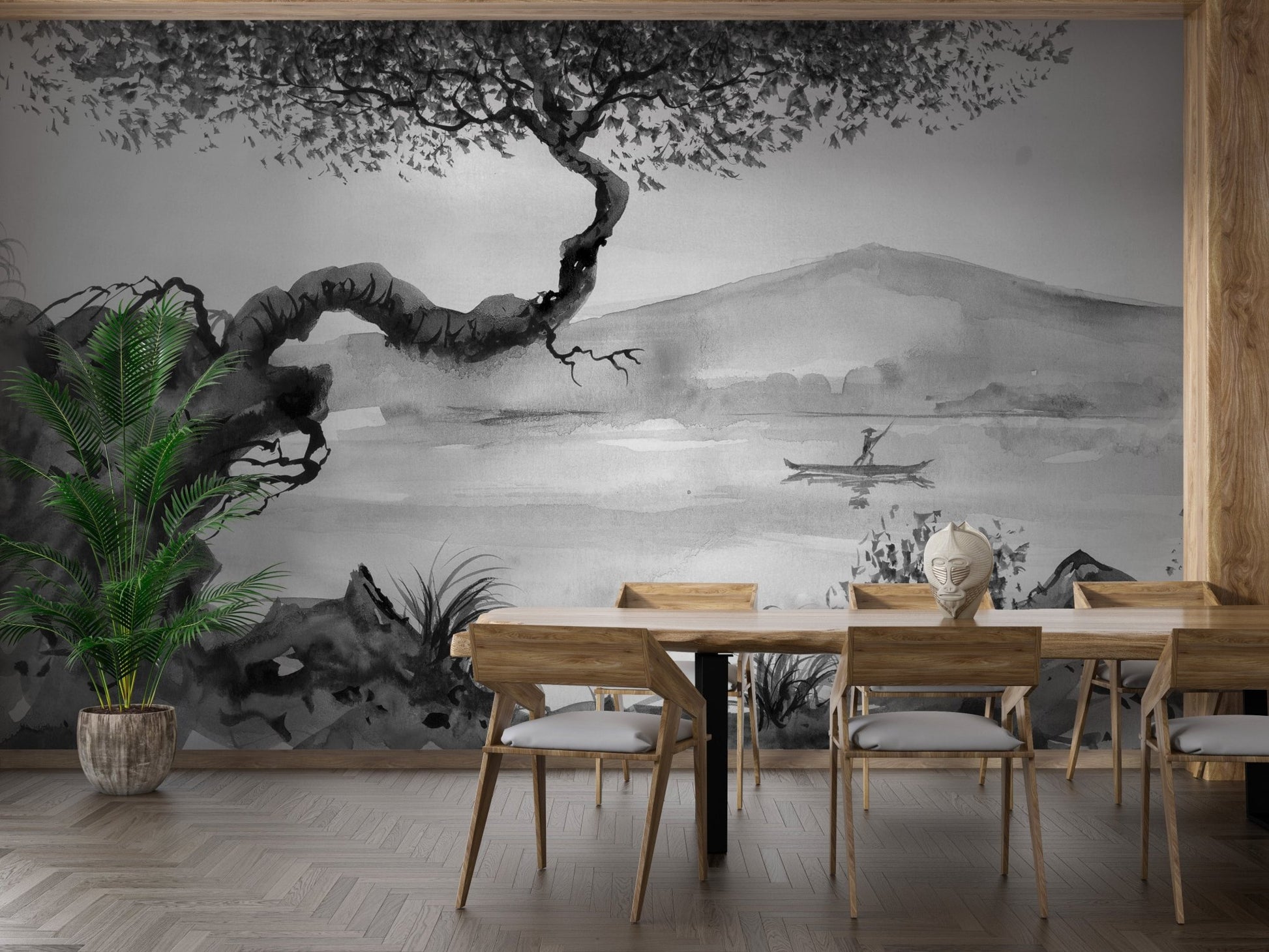 Dining room wall mural showing a black and white lake scene with a wooden table.