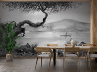 Dining room wall mural showing a black and white lake scene with a wooden table.