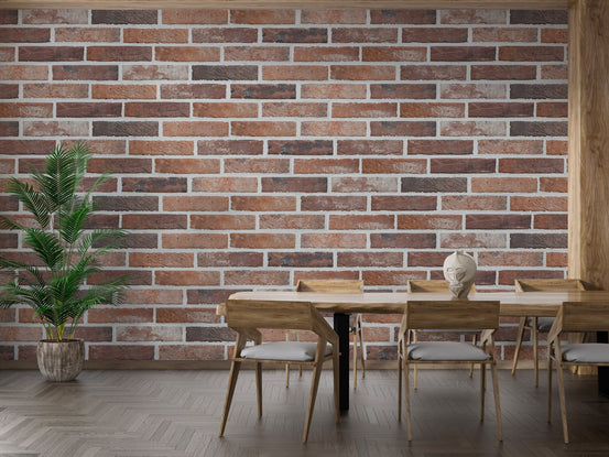 Contemporary dining room with textured brick wall mural and indoor plants.