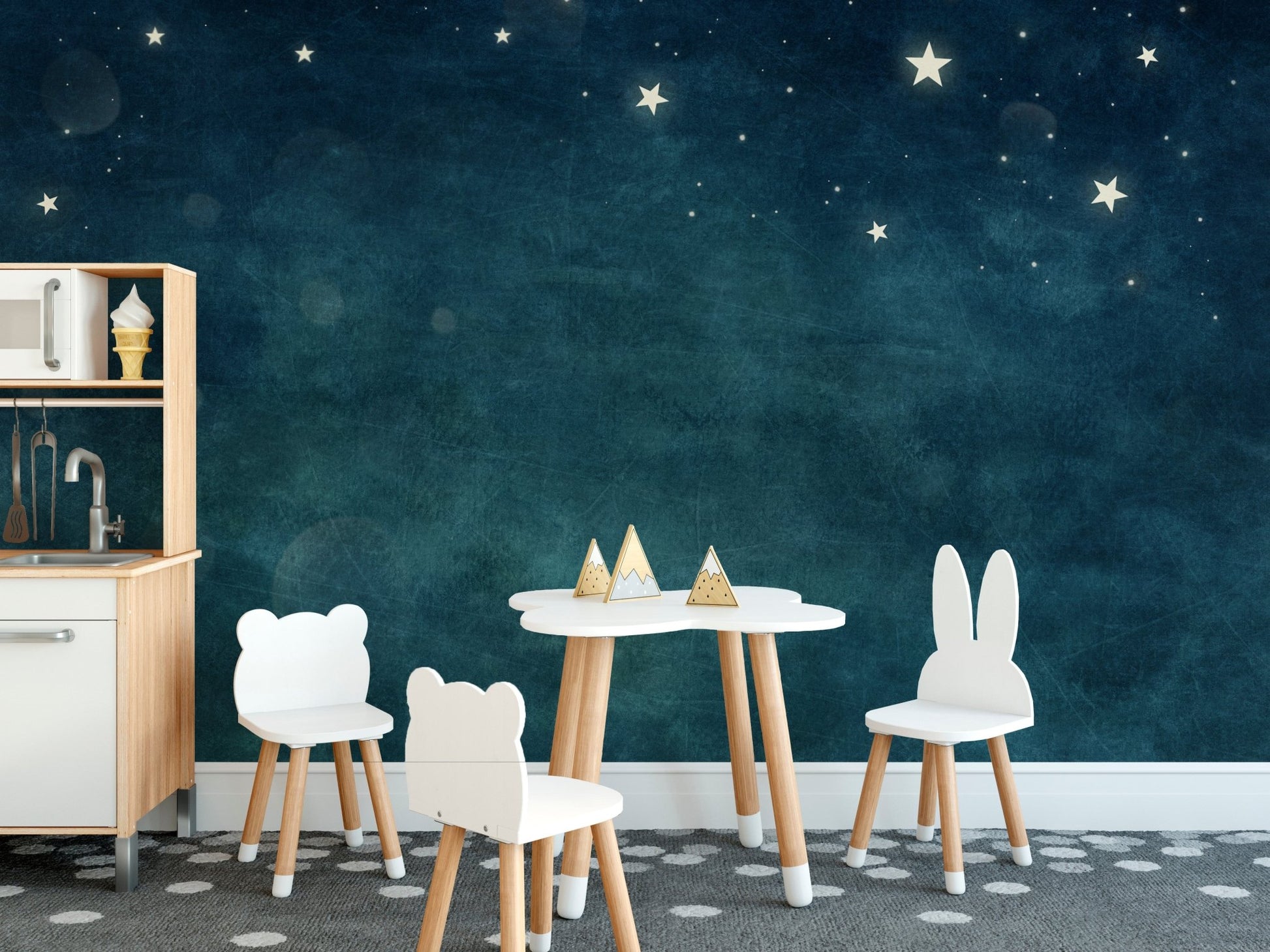 A nursery wall decorated with starry sky themed Blue Nebula Bliss mural