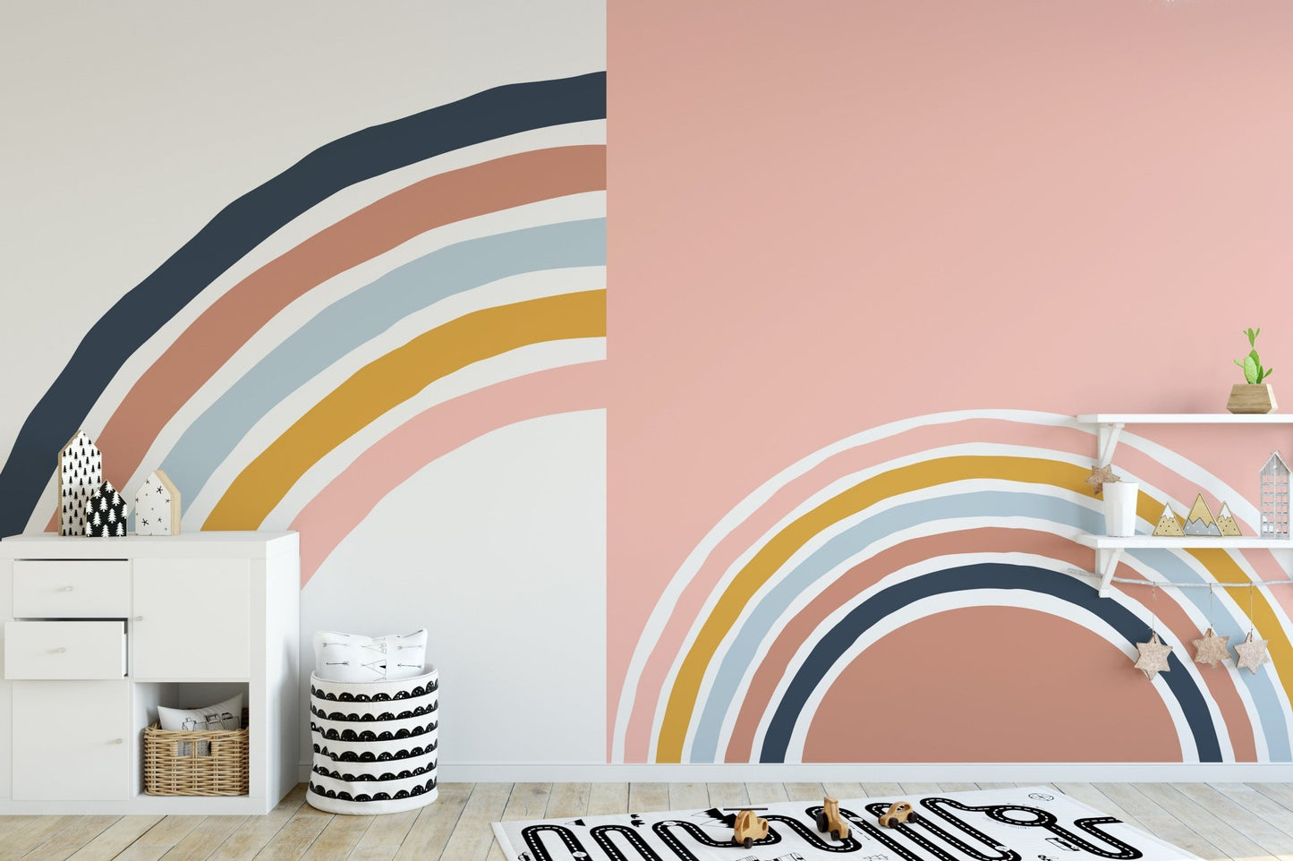 Nursery wall mural with terracotta and blue strips near a small wooden table.