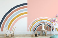 Playroom decor featuring rainbow strips wall murals and mint chairs.
