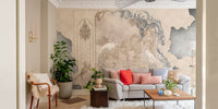 Living space wall mural with soft floral prints on a textured concrete background.