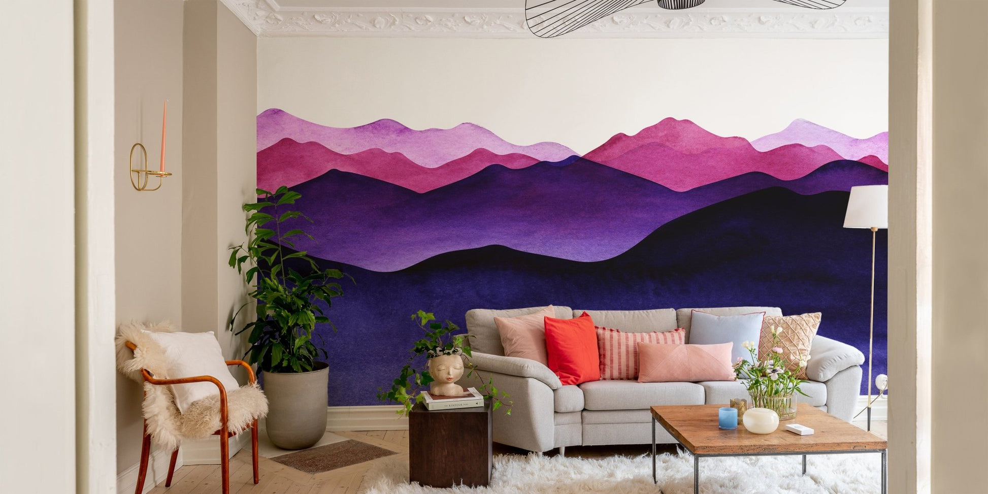 Vibrant purple shade landscape wallpaper mural in a sunlit living area with potted plants.