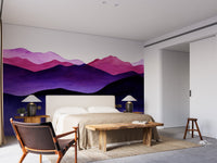 Violet layered hills wall mural in a contemporary bedroom with neutral bedding.