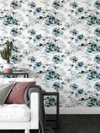 Indigo flower wallpaper in a modern seating area with a white sofa and side table.