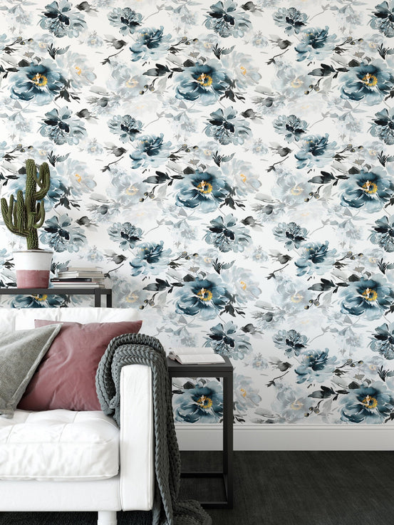 Indigo flower wallpaper in a modern seating area with a white sofa and side table.