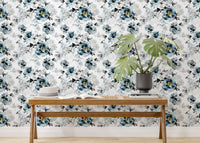 Indigo flower wallpaper in a minimalist room with a bench and green potted plant.