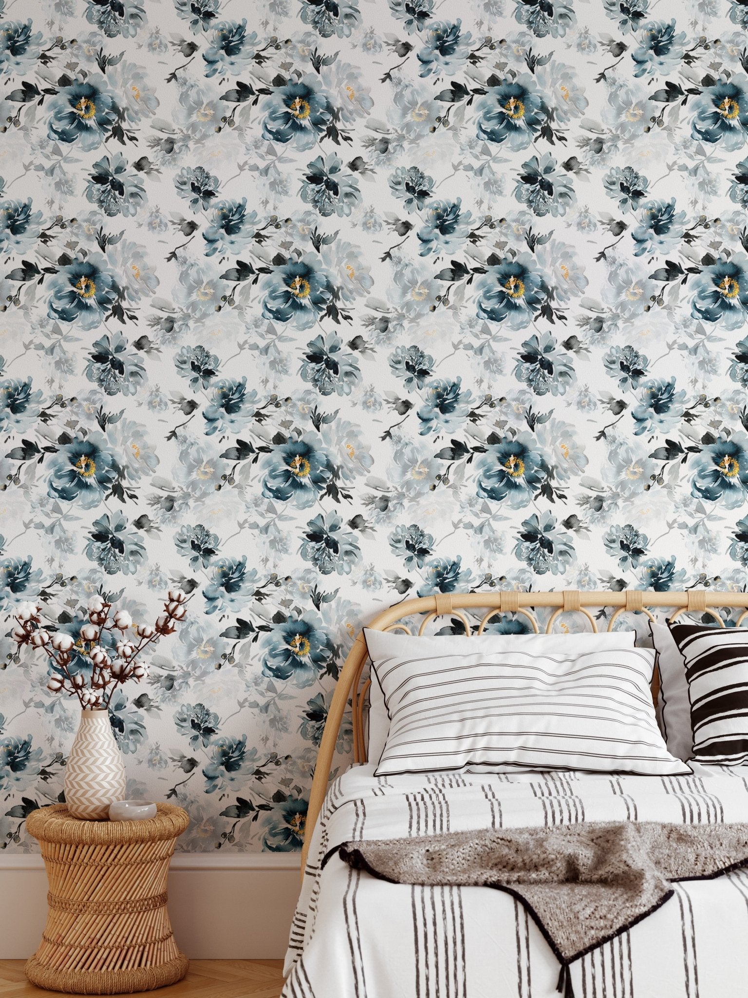 Handmade floral wallpaper in a bedroom setting with white bedding and a side table.