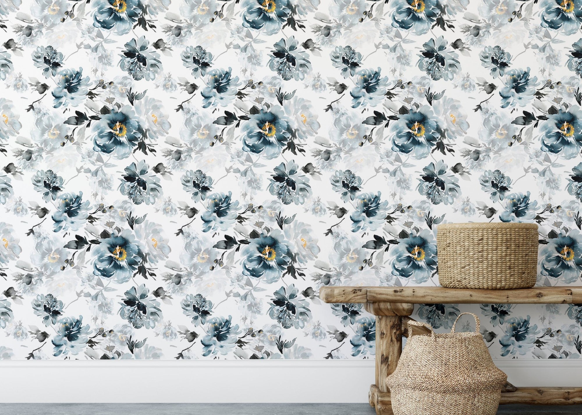 Indigo watercolor flower wallpaper on a living room wall behind a wooden bench.