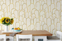 Breakfast nook featuring wooden table and archway wallpaper