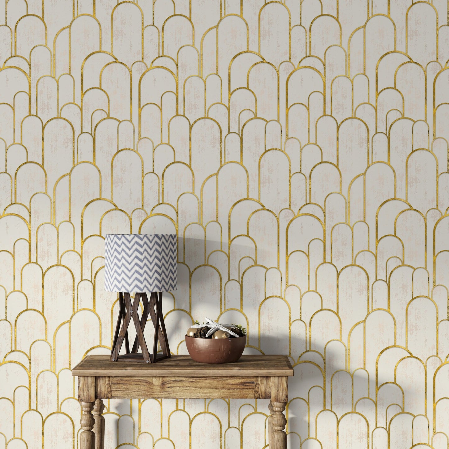 Elegant gold Deco archway design wallpaper behind wooden table.