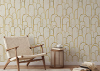 Art Deco golden arches wallpaper in repeating wall patterns for study area.