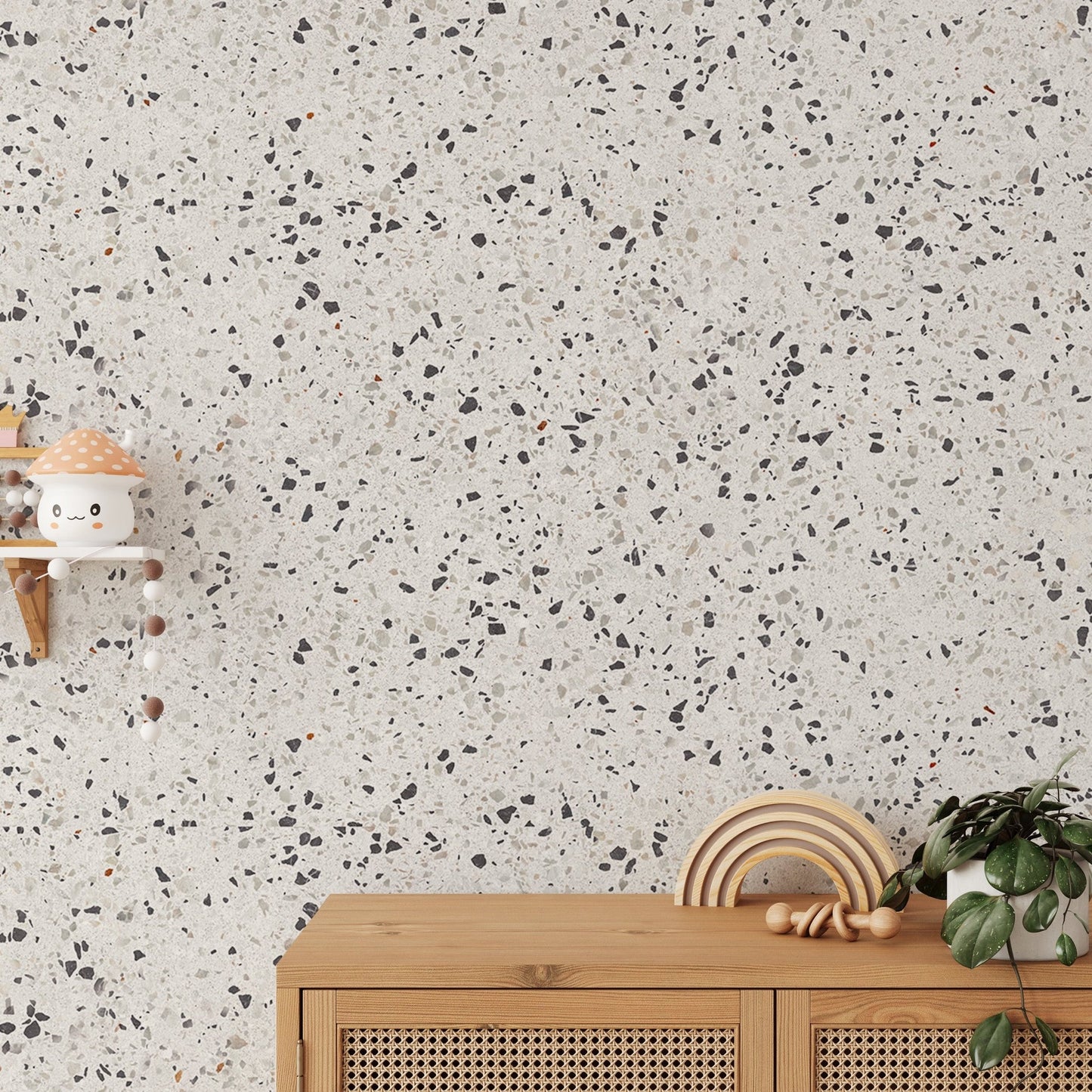 Textured stone wallpaper behind a wooden console unit and hanging decor.