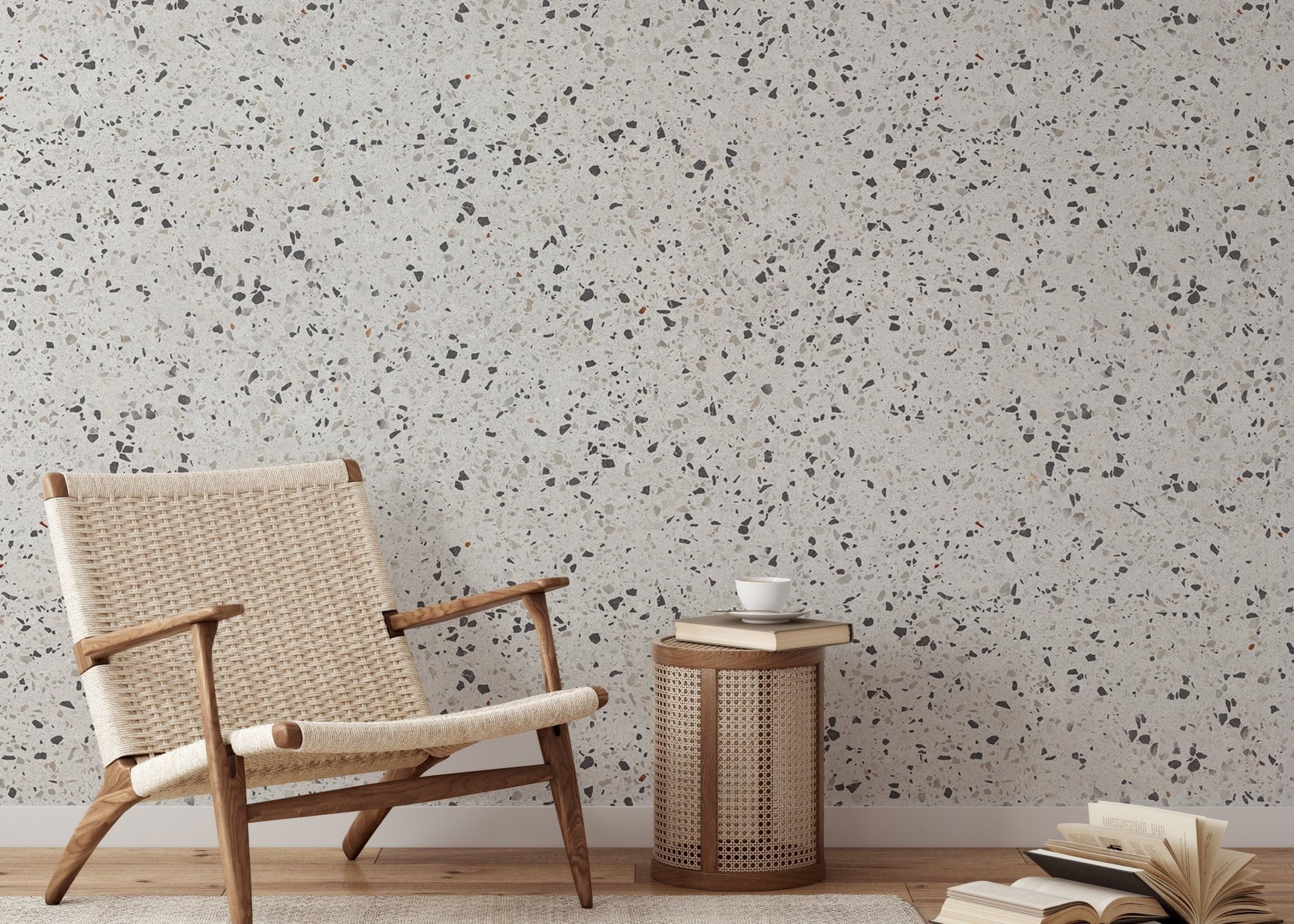 Stone texture wallpaper in reading space with a wooden chair and side table.
