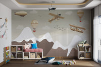 Vintage aviation wall mural with old aircraft and white clouds over hills.