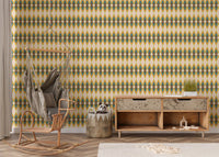 Modern rocking chair placed against a striped wall mural in a nursery area.