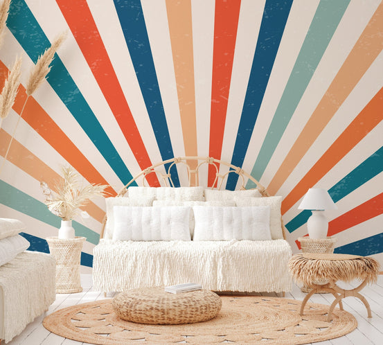Retro sunburst geometric wallpaper with orange and teal radiating rays.
