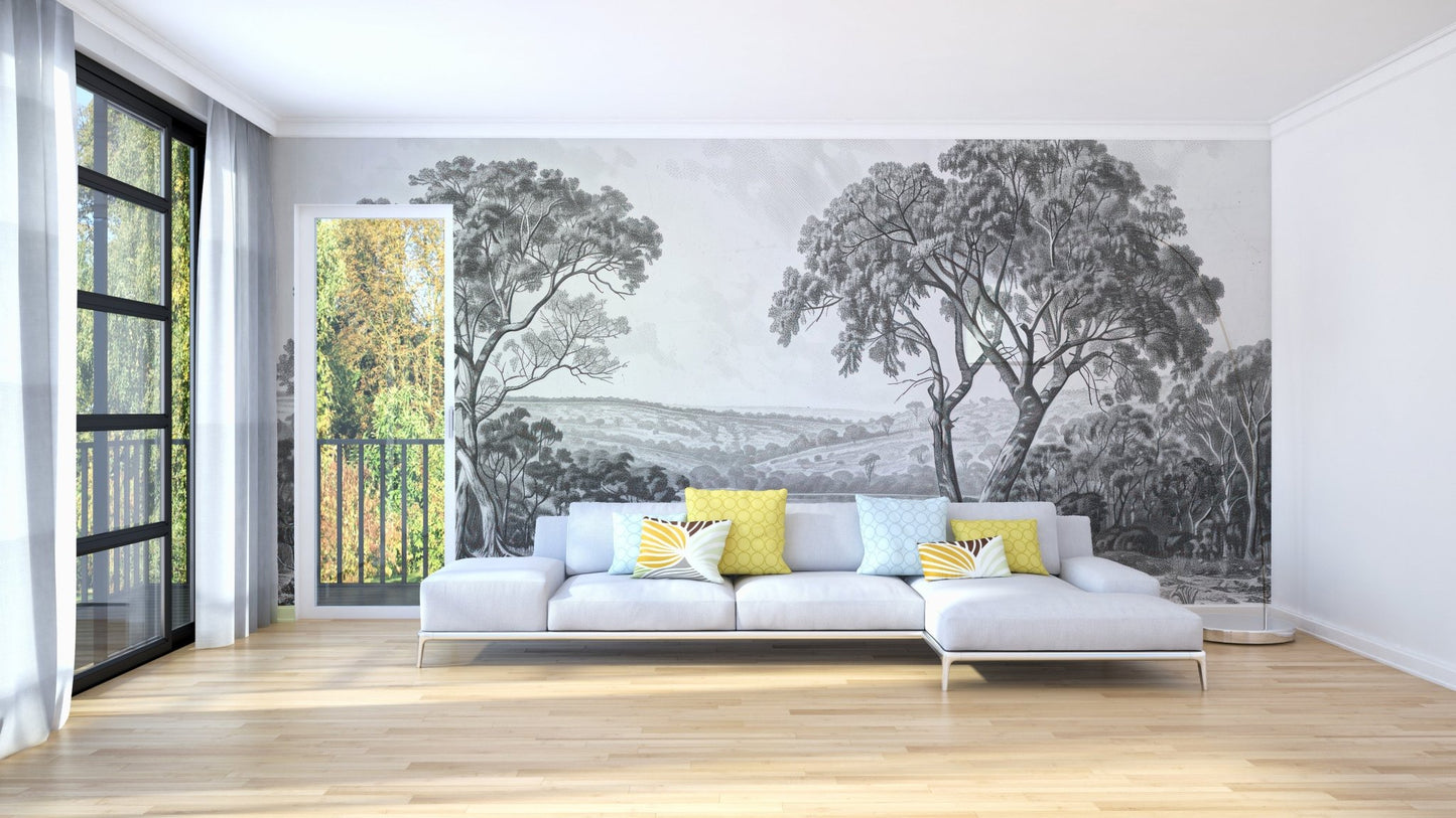 Monochrome river wall mural behind a white sofa in a modern living room.