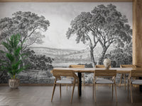 Grey tonal wall mural showing a river scene in a formal dining room.