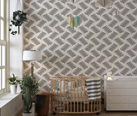 Ripple Monochrome Geometric Waves Wallpaper in a nursery with a wooden crib.