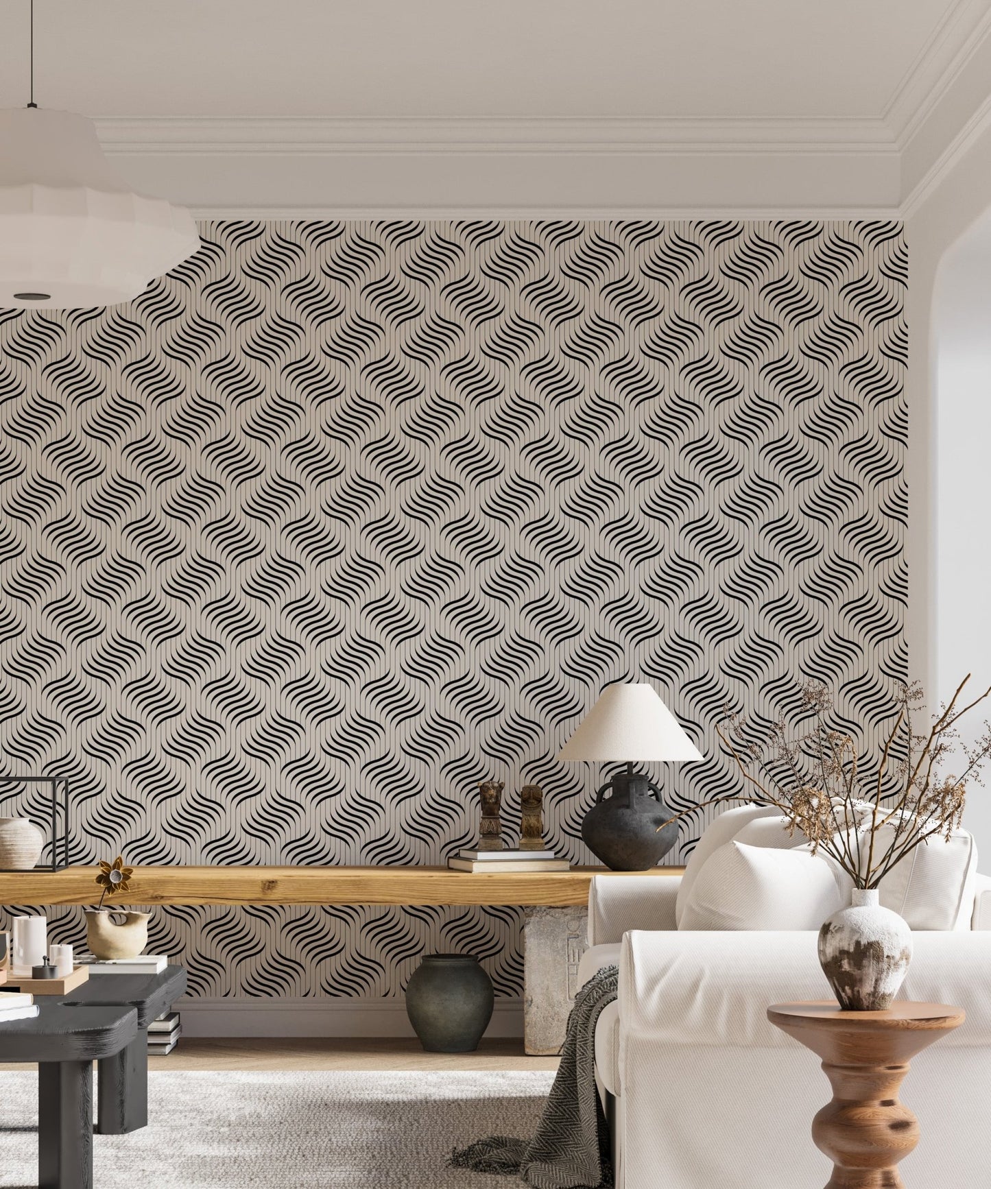 Geometric wavy wallpaper in a living area with a lamp and side table.