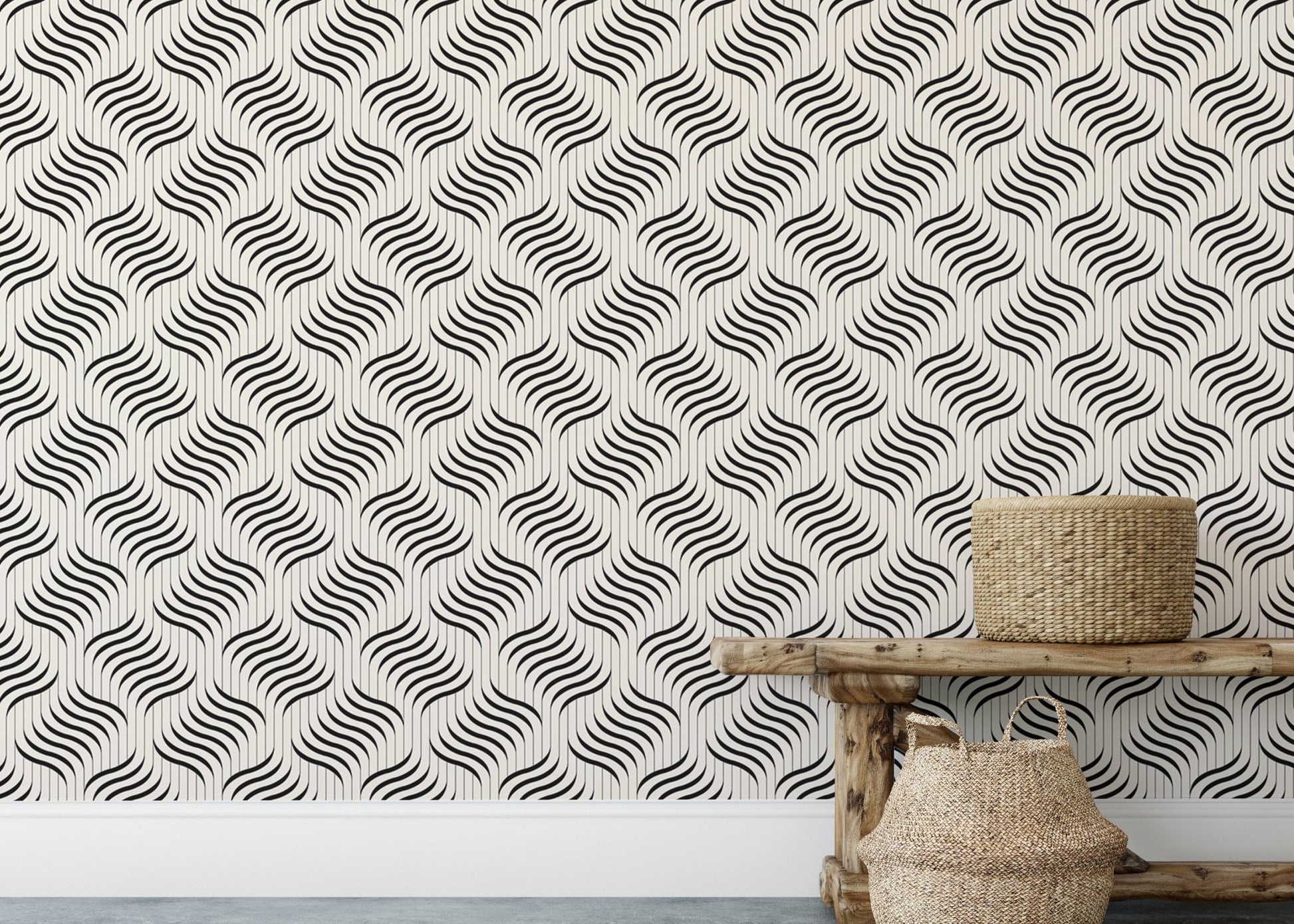 Grey repeating wave wallpaper behind a wooden bench and woven basket.
