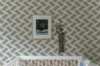 Ripple Monochrome Geometric Waves Wallpaper in a playroom with white furniture.