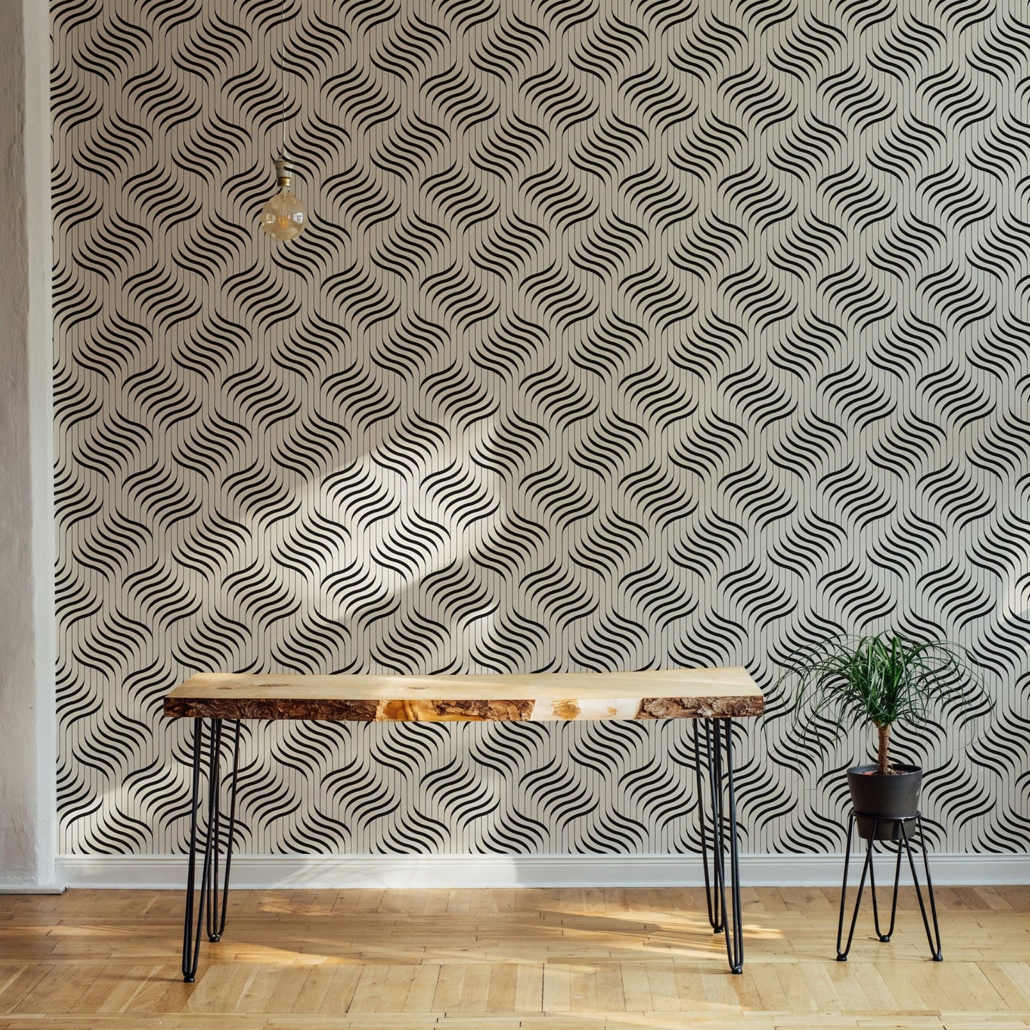 Monochrome wavy pattern wallpaper on a feature wall with indoor plants.
