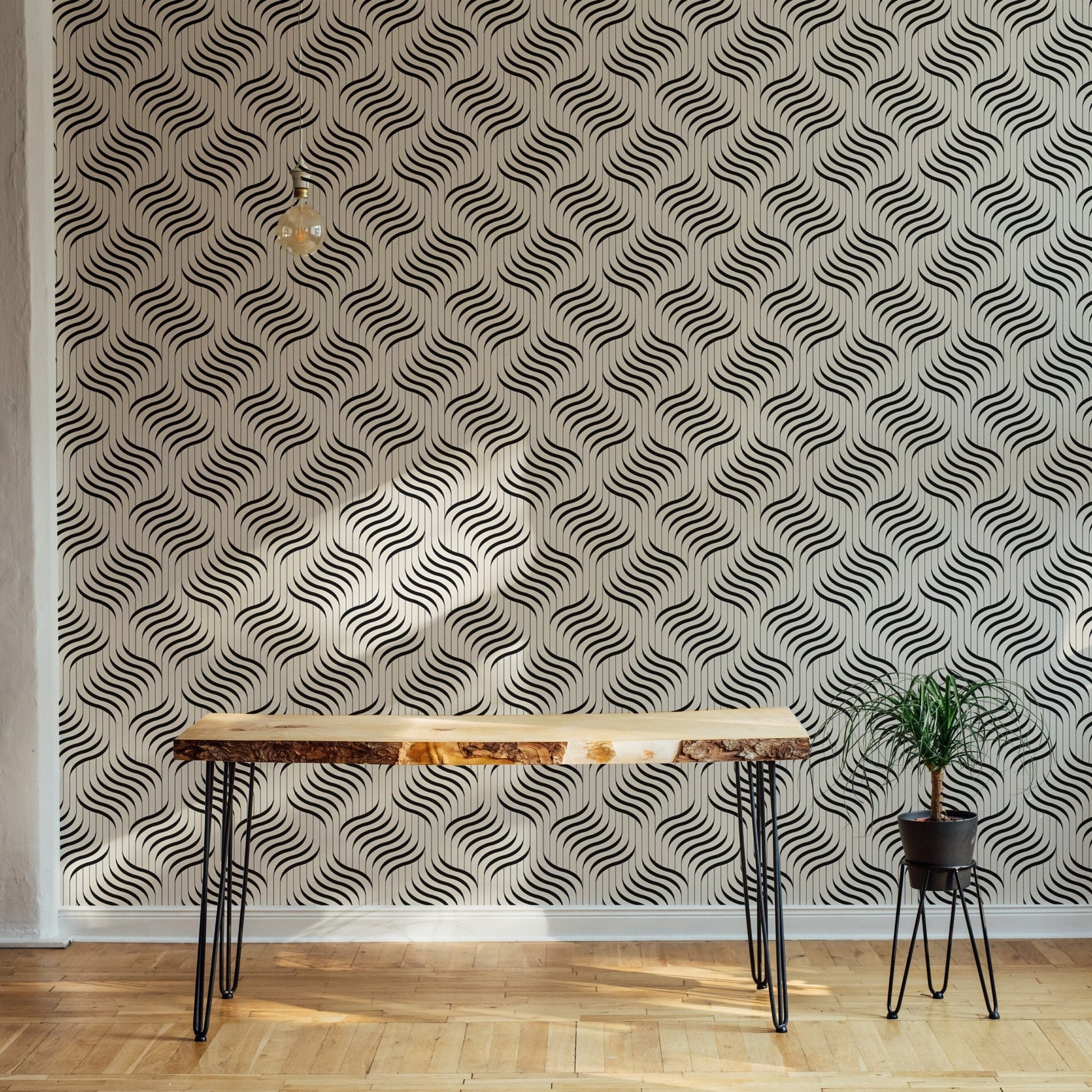 Monochrome wavy pattern wallpaper on a feature wall with indoor plants.