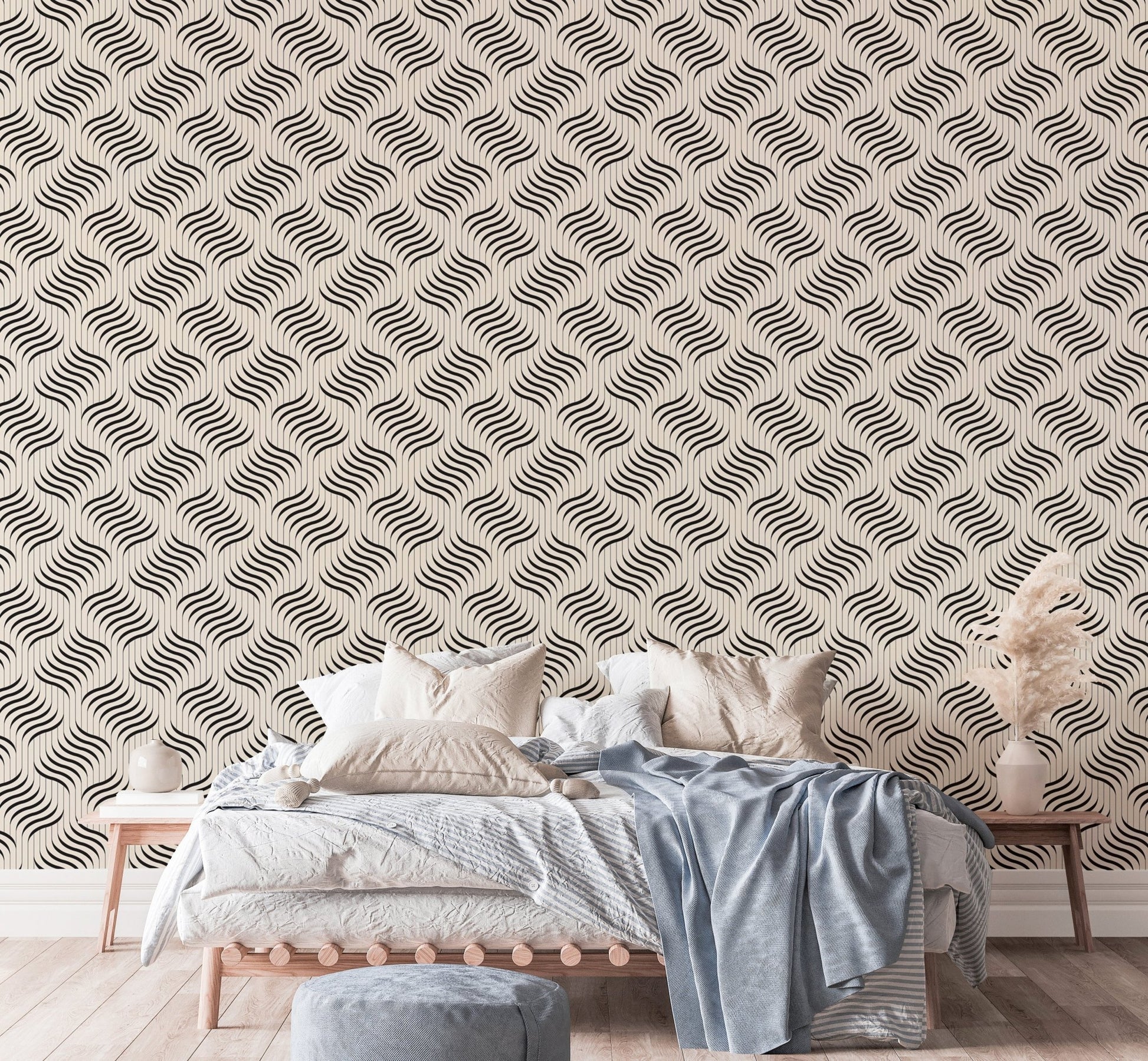Grey and white wavy pattern wallpaper behind a living room sofa.