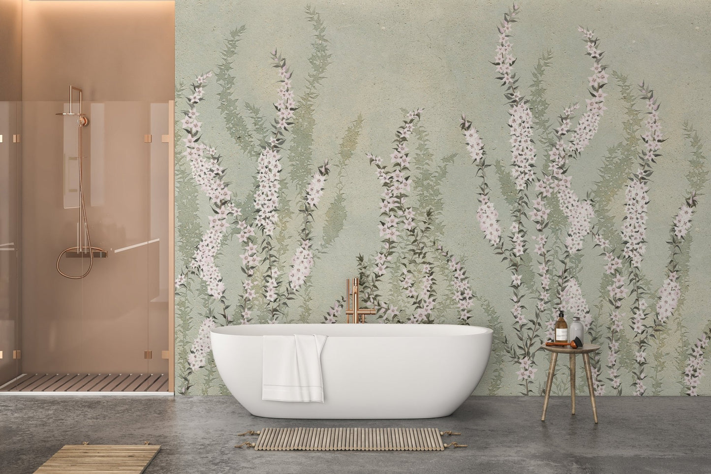 White freestanding bathtub against green botanical wall mural in a modern bathroom.