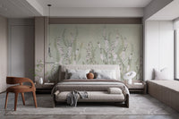 Modern flat bedroom with low bed and green floral wall mural background.