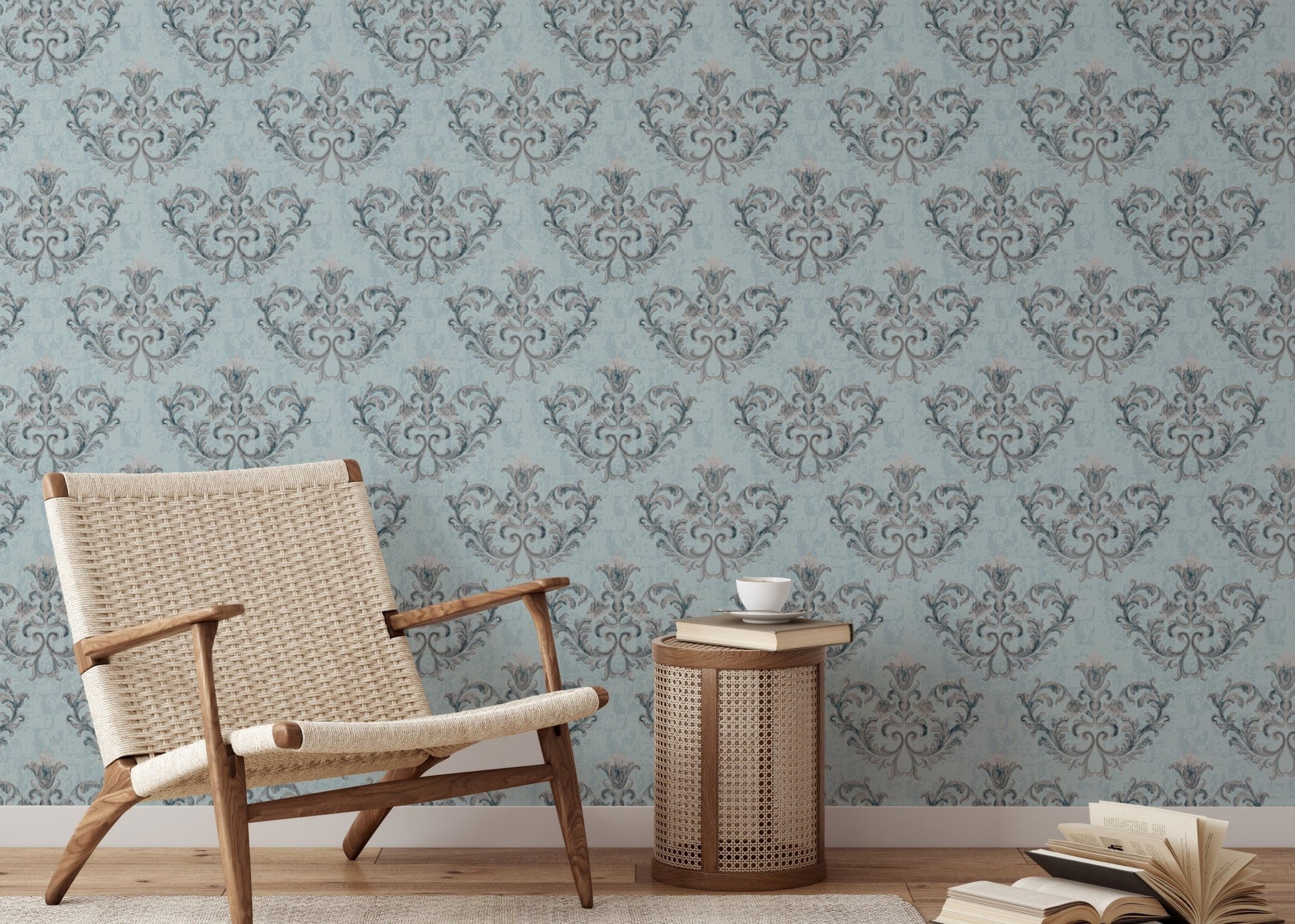Patterned grey floral wallpaper in a reading area with a wooden armchair.
