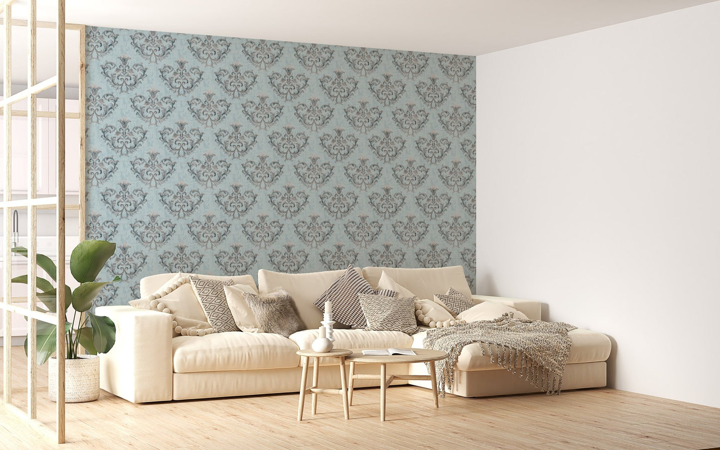 Blue floral wallpaper in a bright living room with a white sectional sofa.