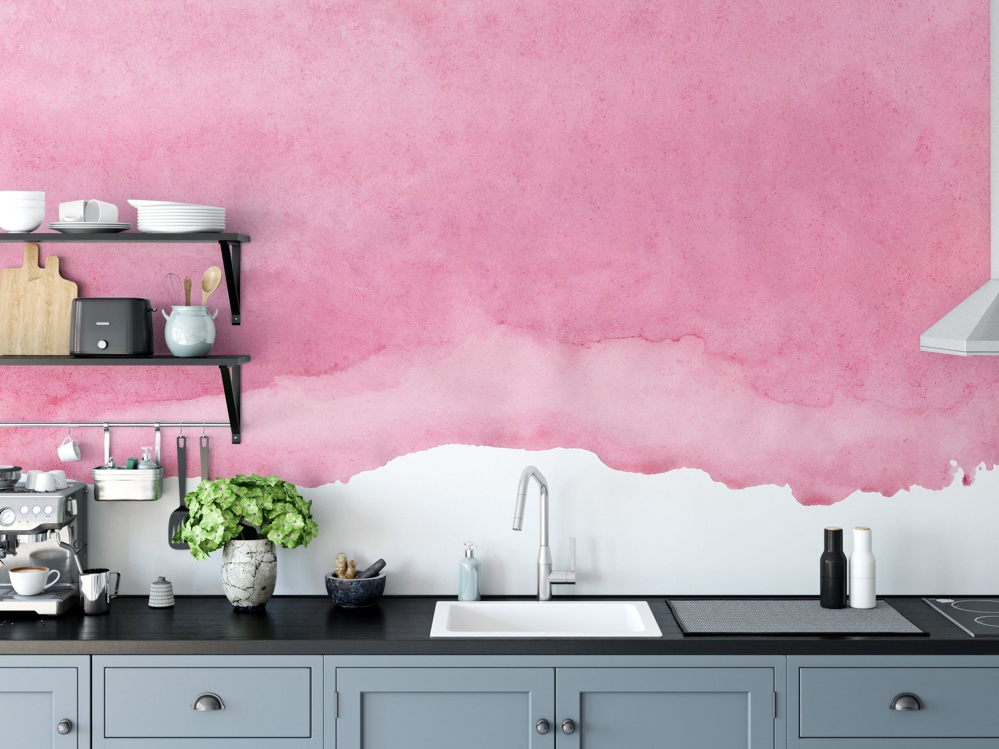 Pink watercolor wall mural behind a modern kitchen counter and sink.