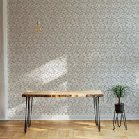 Royal Floral Ornament Beautiful Damask Pattern Wallpaper in living area with wood table.