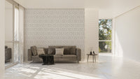 Damask pattern wallpaper in large living room with grey sofa and floor lamp.